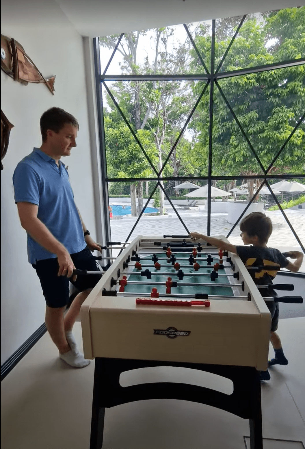 two people playing foosball