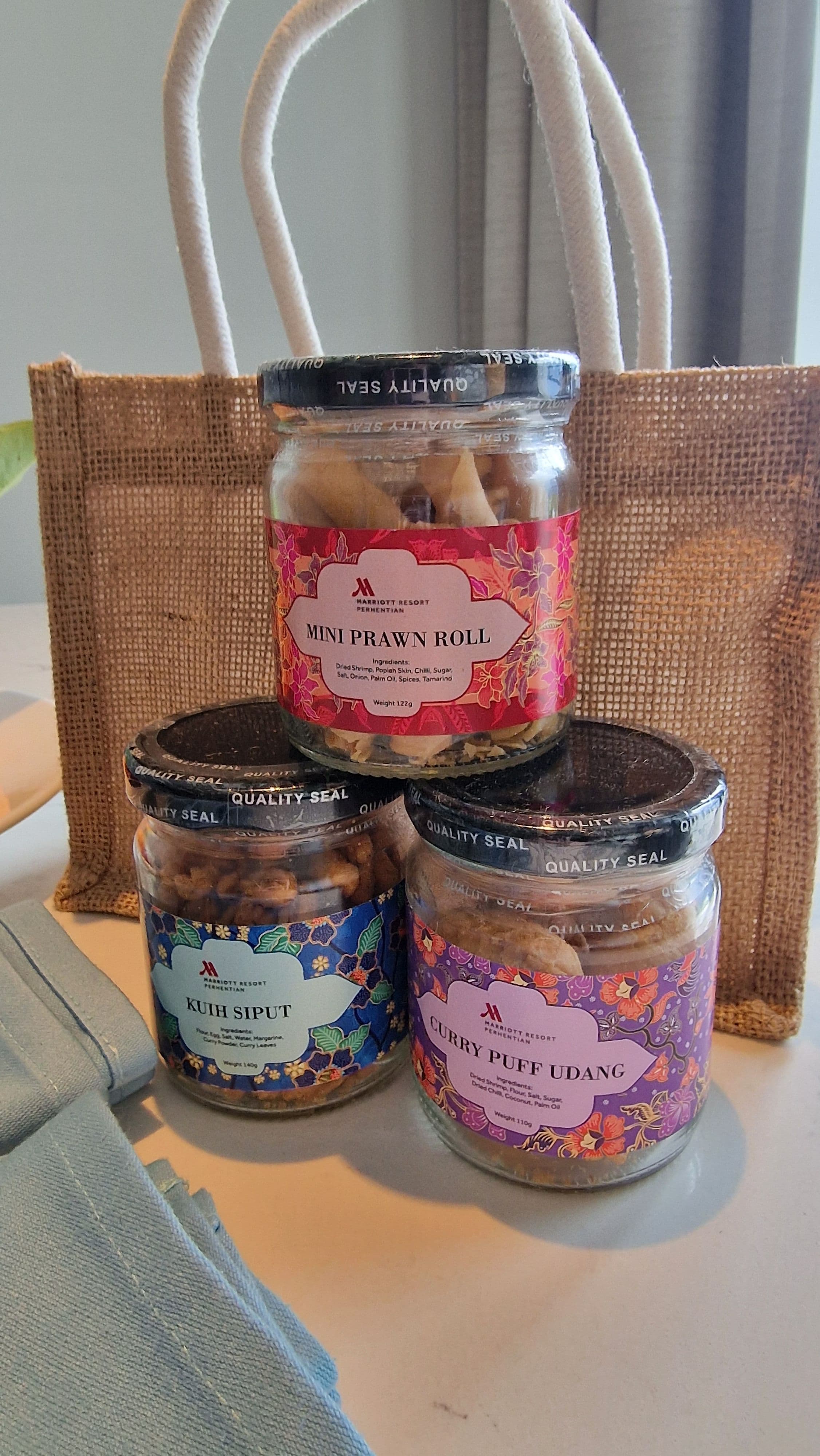 three bottles with malaysian snacks